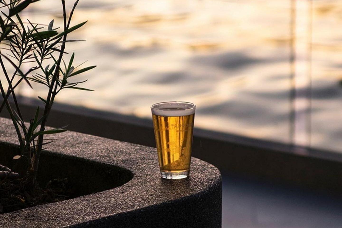 The Salil Hotel Riverside Bangkok Exterior photo A glass of beer