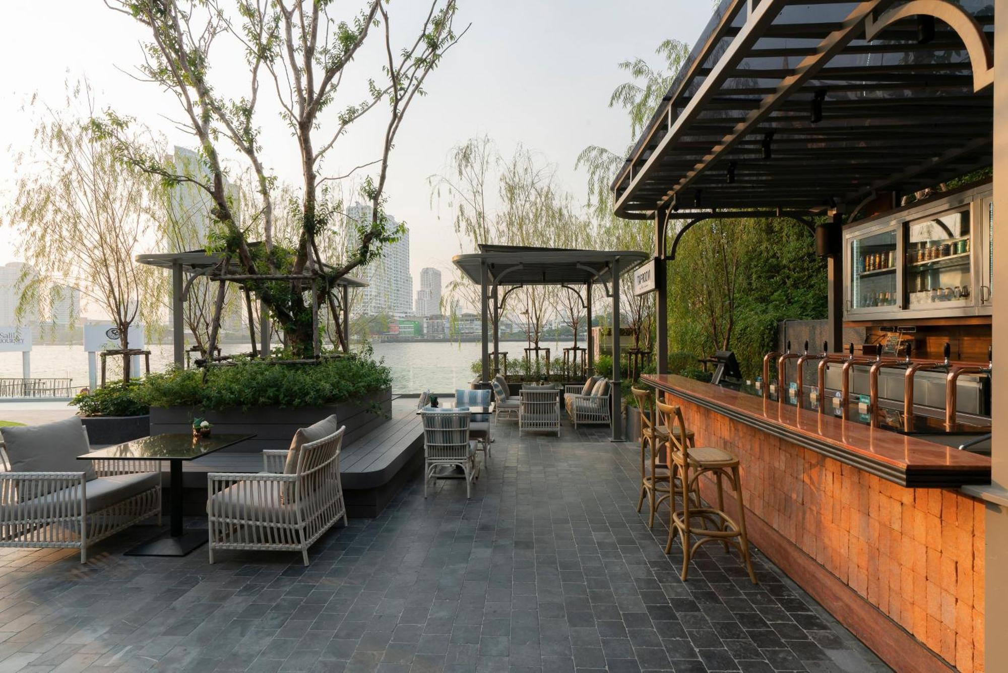 The Salil Hotel Riverside Bangkok Exterior photo The bar at the rooftop of the hotel